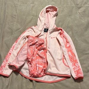 Girls Nike jogging suit, gently worn size 4 light pink and orange